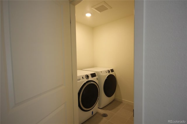 4955 Trails Edge Ln, Castle Rock, CO 80104 - washroom with washer and clothes dryer, baseboards, and light tile patterned floors