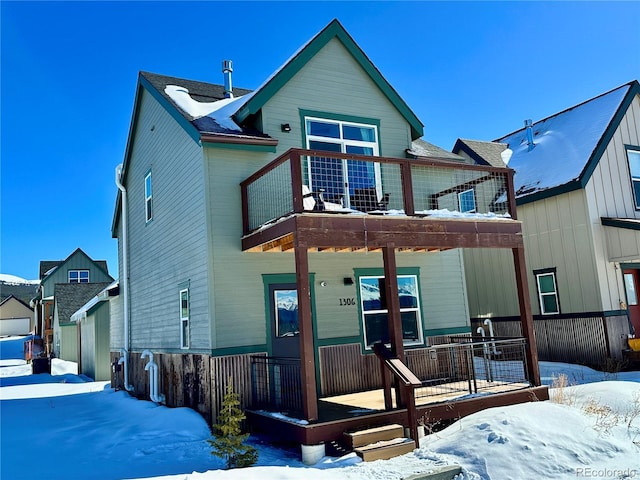 view of front of home featuring a balcony and covered porch