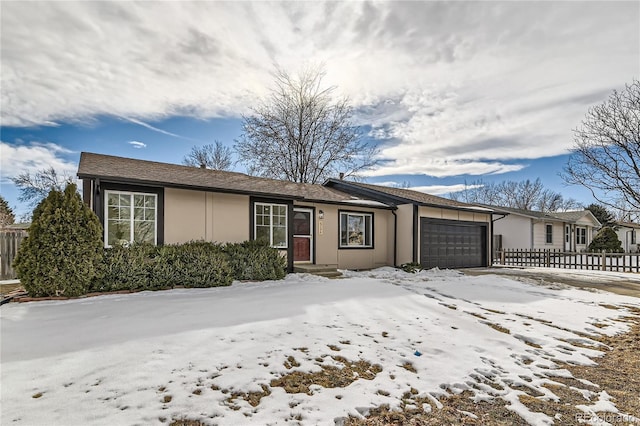 ranch-style home with a garage