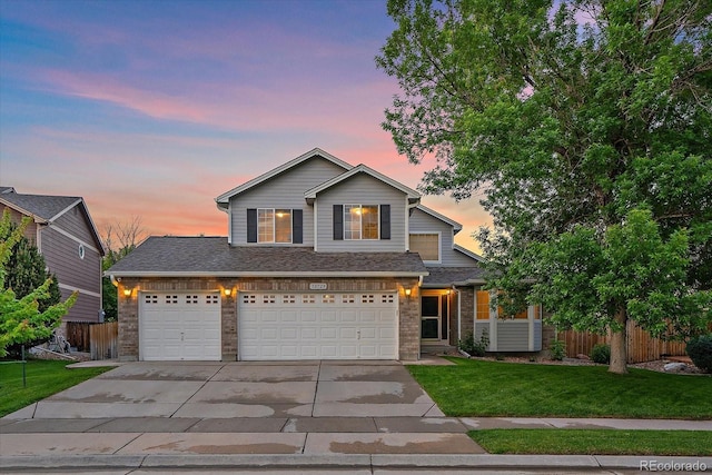 10723 W 54th Pl, Arvada, CO 80002 - traditional-style house with driveway, brick siding, and a garage