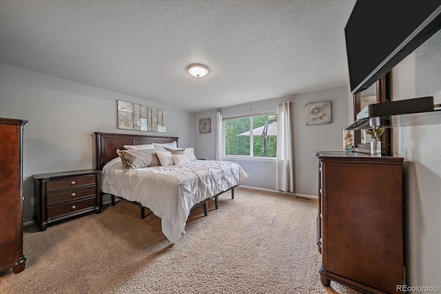 10723 W 54th Pl, Arvada, CO 80002 - bedroom with light colored carpet and a textured ceiling