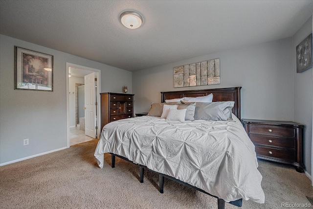 10723 W 54th Pl, Arvada, CO 80002 - bedroom featuring carpet flooring, baseboards, and ensuite bathroom