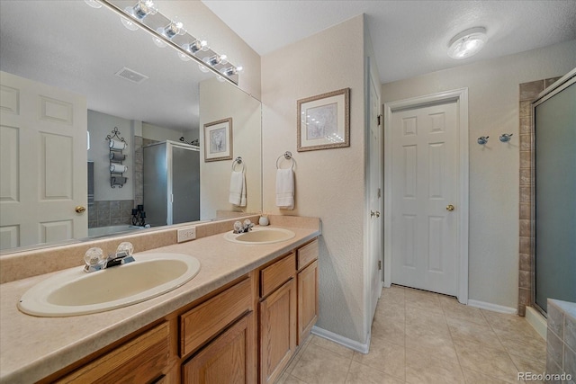 10723 W 54th Pl, Arvada, CO 80002 - full bath with a shower stall, double vanity, tile patterned floors, and a tub to relax in