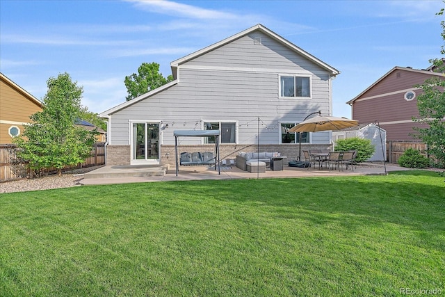 10723 W 54th Pl, Arvada, CO 80002 - back of house with a patio, an outdoor living space, and brick siding