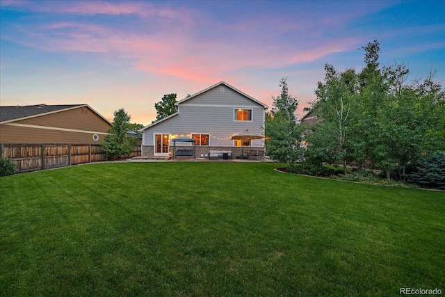 10723 W 54th Pl, Arvada, CO 80002 - back of property at dusk with a patio area