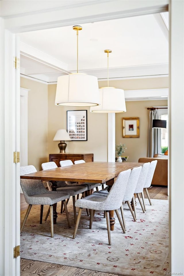 dining area with hardwood / wood-style flooring