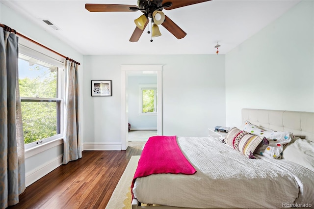 bedroom featuring ceiling fan and dark hardwood / wood-style flooring