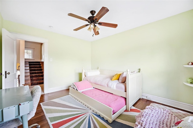 bedroom featuring dark wood-type flooring and ceiling fan