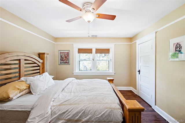 bedroom featuring dark wood-type flooring and ceiling fan