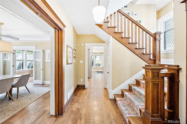 stairs featuring hardwood / wood-style floors