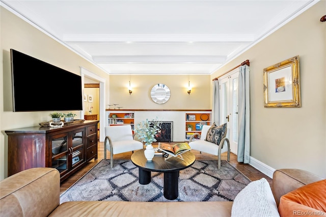 living room featuring beam ceiling and light hardwood / wood-style flooring