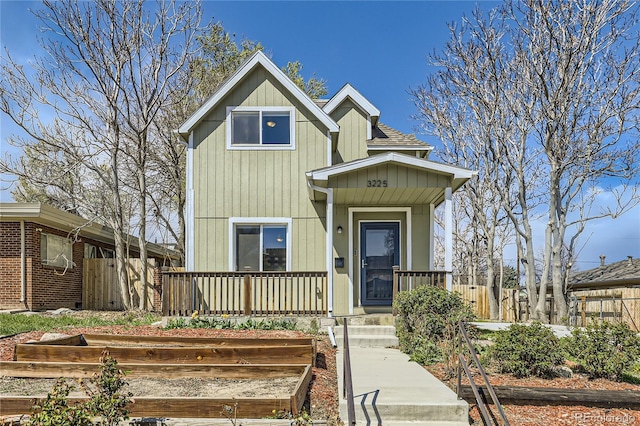 3225 Olive St, Denver, CO 80207 - view of front of house featuring a porch and a garden
