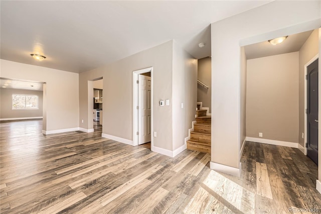 3225 Olive St, Denver, CO 80207 - unfurnished room featuring stairs, wood finished floors, and baseboards