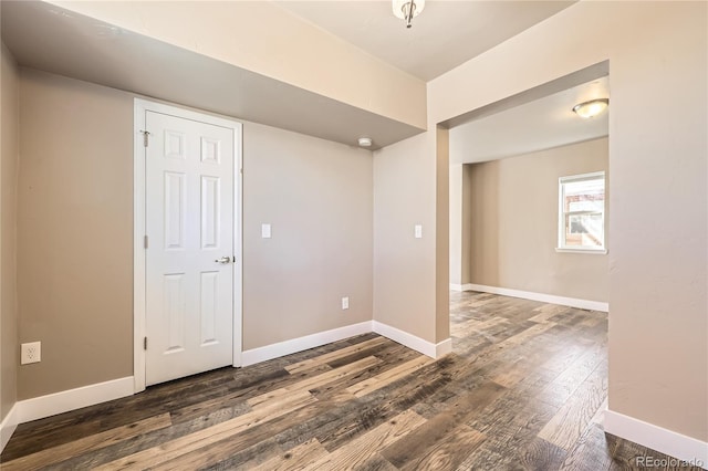 3225 Olive St, Denver, CO 80207 - empty room with wood finished floors, baseboards, and a smoke detector