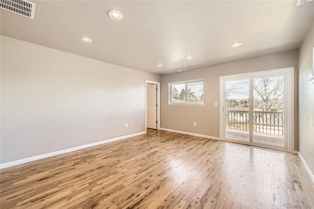 3225 Olive St, Denver, CO 80207 - empty room featuring baseboards, light wood-style flooring, and recessed lighting