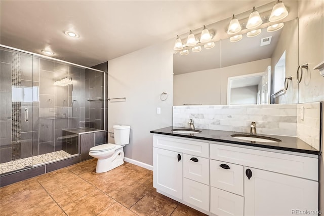 3225 Olive St, Denver, CO 80207 - bathroom with toilet, double vanity, backsplash, tile patterned flooring, and a shower stall