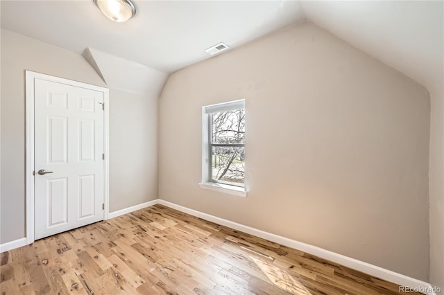 3225 Olive St, Denver, CO 80207 - bonus room featuring lofted ceiling, light wood-style flooring, and baseboards