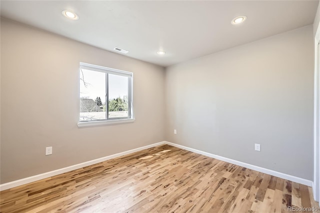3225 Olive St, Denver, CO 80207 - spare room with baseboards, light wood-style floors, and recessed lighting