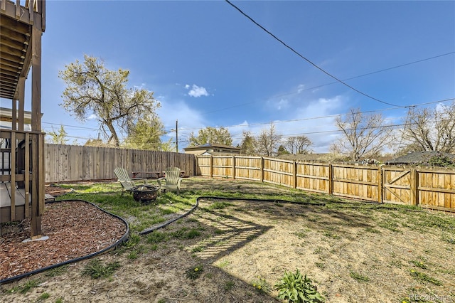 3225 Olive St, Denver, CO 80207 - fenced backyard with an outdoor fire pit