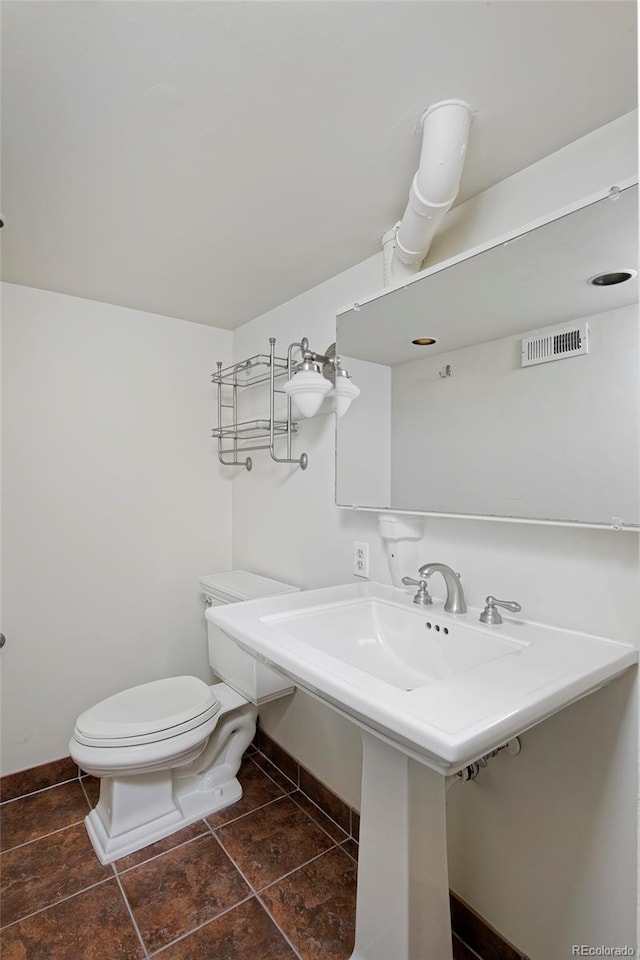 bathroom featuring toilet