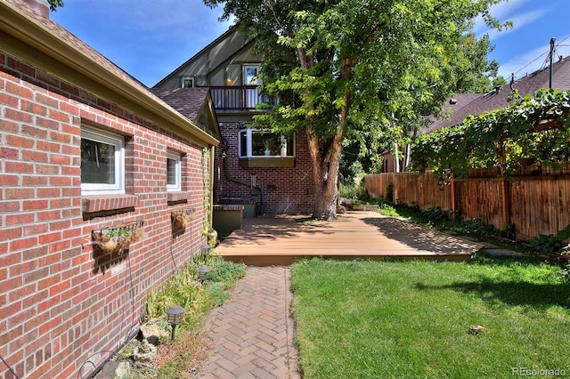 view of yard featuring a balcony