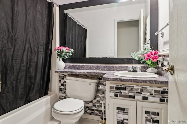 full bath featuring toilet, vanity, and shower / bath combination with curtain