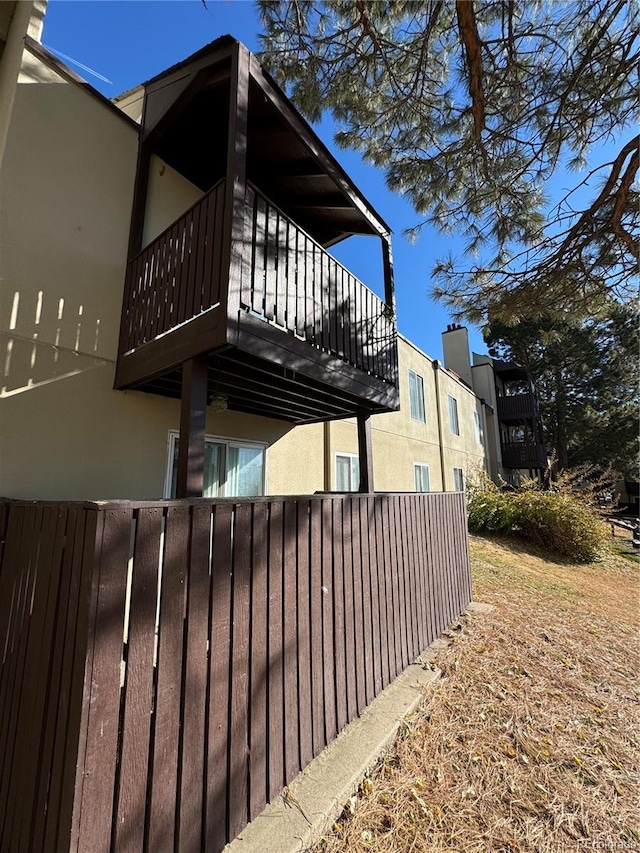 view of home's exterior with a balcony