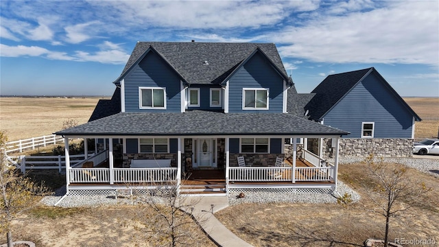 farmhouse inspired home featuring covered porch