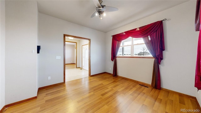 spare room with light hardwood / wood-style flooring and ceiling fan