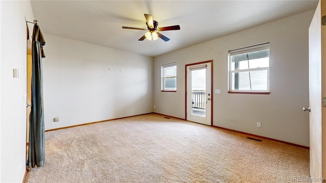 unfurnished room featuring ceiling fan and light colored carpet