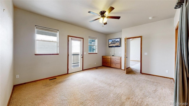 unfurnished bedroom with ceiling fan, access to exterior, and light colored carpet