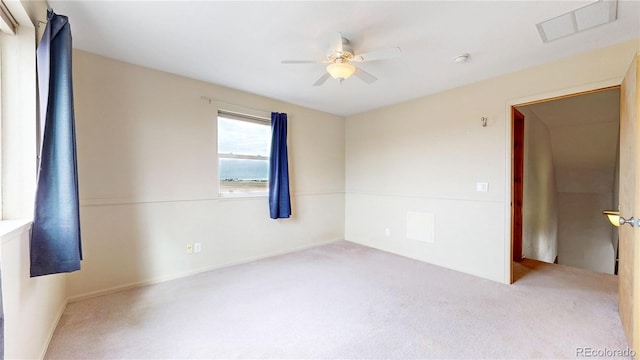 carpeted empty room featuring ceiling fan