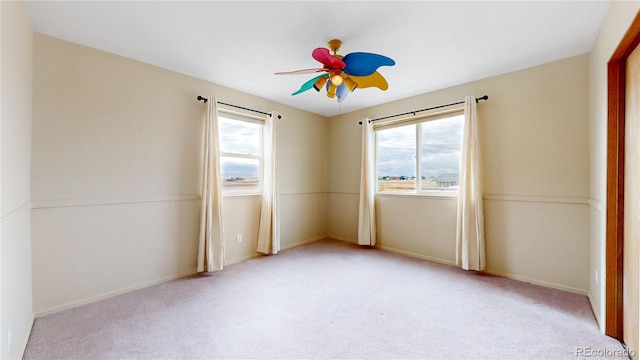 unfurnished room with light carpet