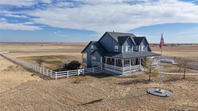 view of front of house featuring a rural view