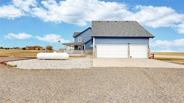 view of front of property with a garage and covered porch