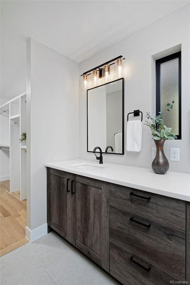 bathroom with vanity and hardwood / wood-style flooring