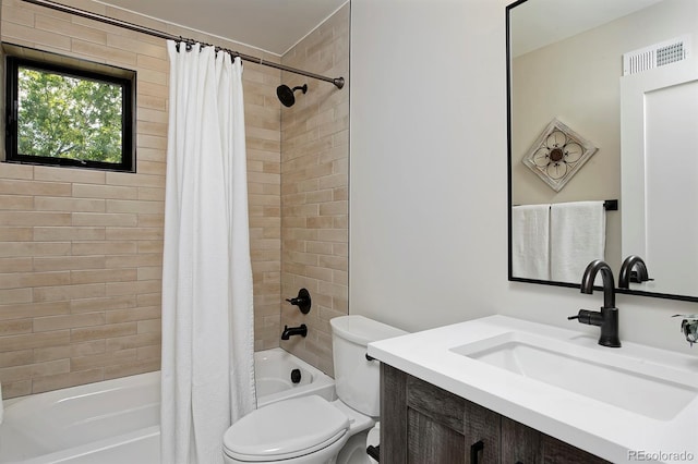 full bathroom with shower / bath combination with curtain, vanity, and toilet