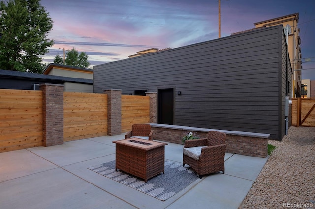 patio terrace at dusk with an outdoor fire pit