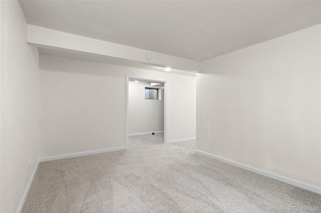 interior space with baseboards and carpet flooring