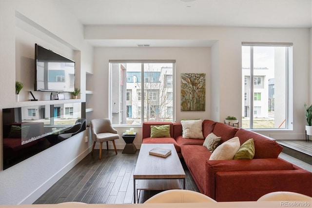 living room with dark hardwood / wood-style flooring