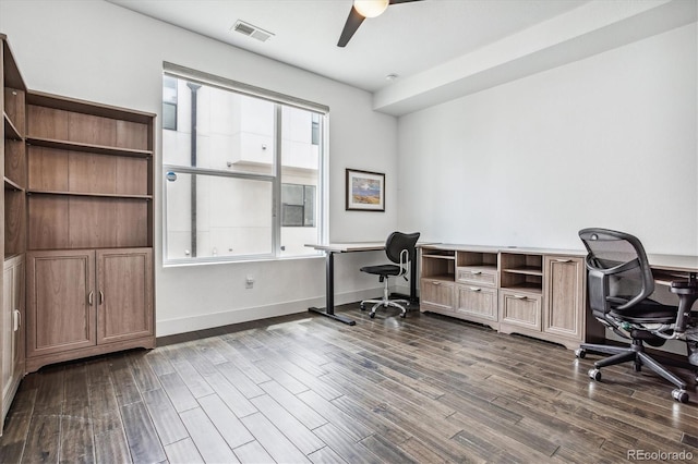 home office featuring dark wood-type flooring and ceiling fan