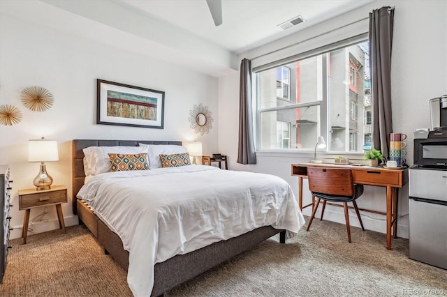 bedroom featuring ceiling fan and carpet