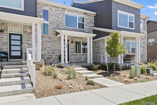 762 N Rome St, Aurora, CO 80018 - modern home featuring covered porch and stone siding