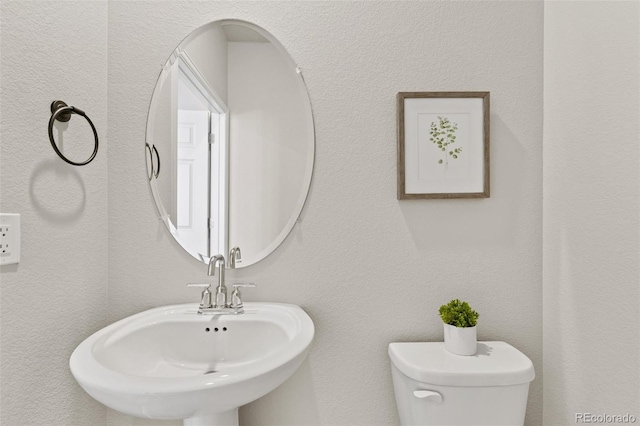 762 N Rome St, Aurora, CO 80018 - half bath with a sink and toilet