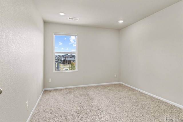 762 N Rome St, Aurora, CO 80018 - carpeted spare room with baseboards and recessed lighting