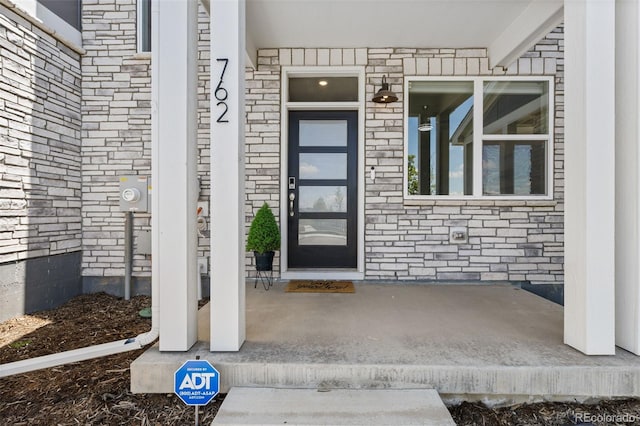 762 N Rome St, Aurora, CO 80018 - doorway to property with stone siding