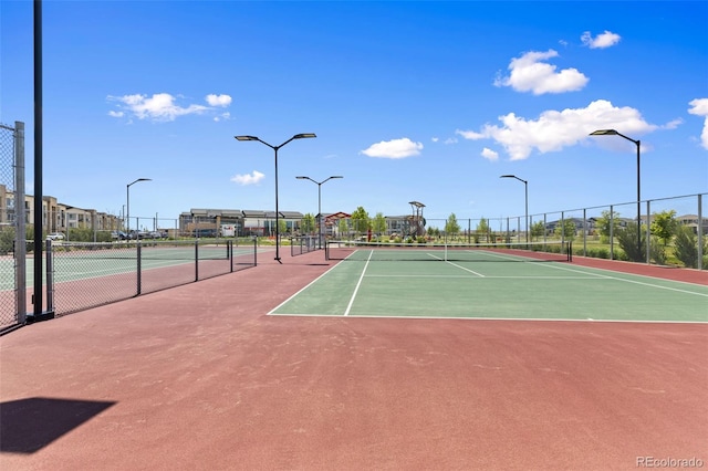 762 N Rome St, Aurora, CO 80018 - view of tennis court with fence and community basketball court