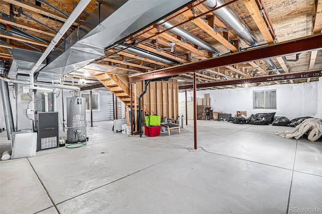 basement with heating unit and water heater