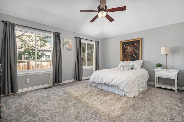 bedroom with ceiling fan and carpet floors