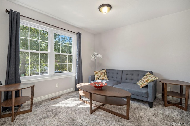 living room with light carpet and plenty of natural light